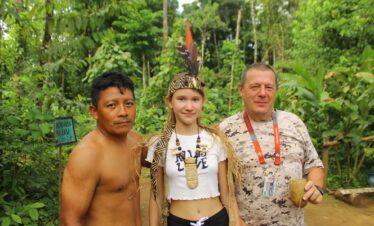 Visitors with traditional headpiece from indigenous Maleku