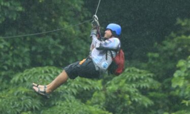 Man canopying in the rainforest of Costa Rica