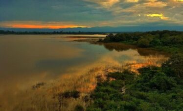 Sun behind the clouds in Caño Negro