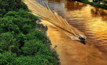 Boat on Caño Negro river golden hour