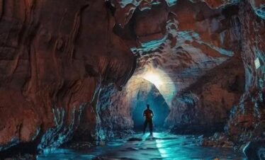 Man at the end of a tunnel in Cavernas del Venado