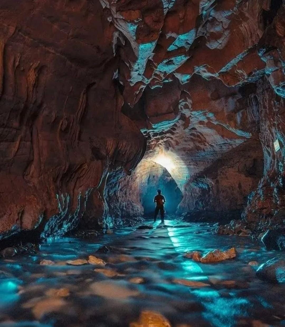 Man at the end of a tunnel in Cavernas del Venado