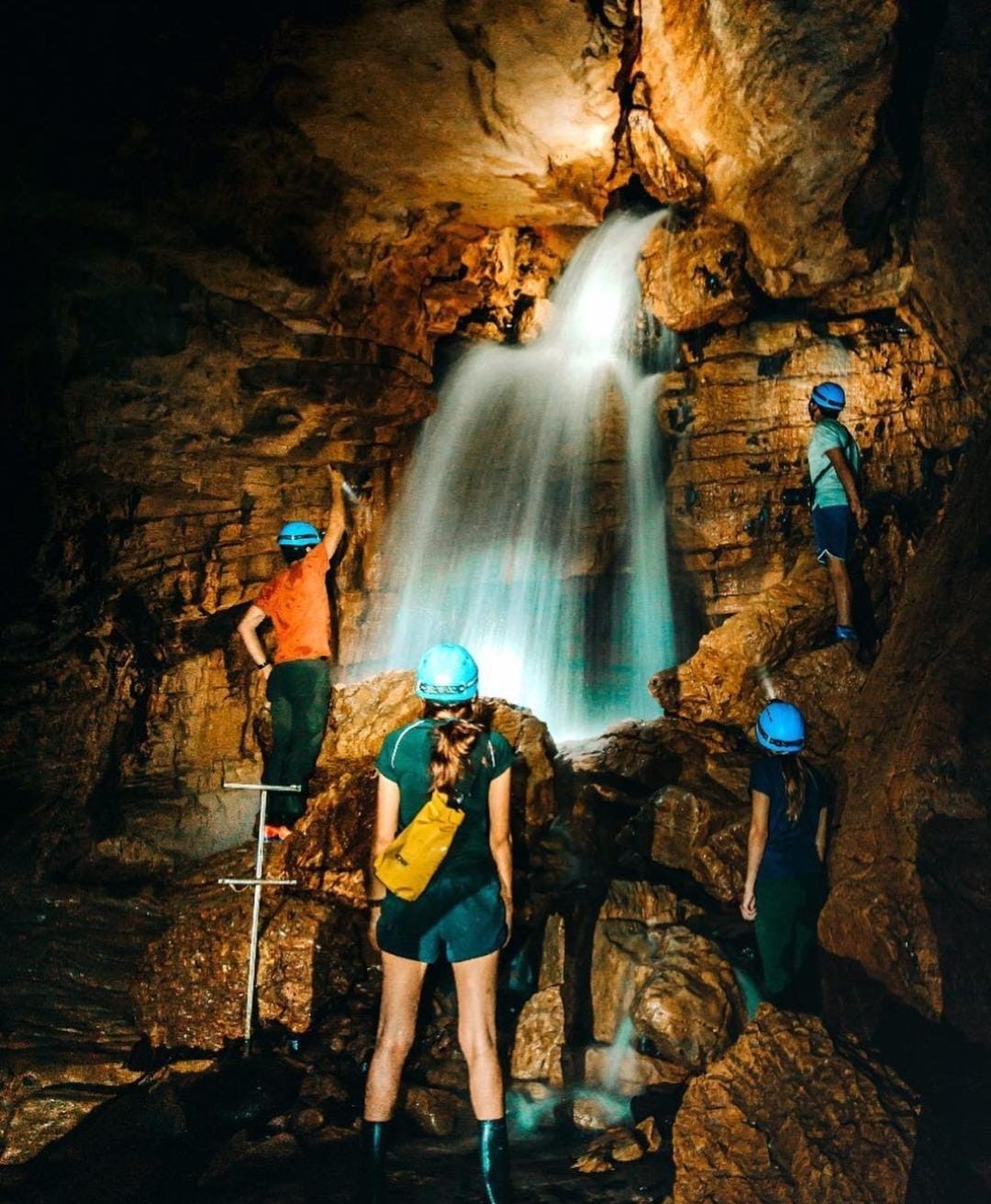 Small group admiring subterranean waterfall in Cavernas del Venado